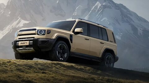 Sand-coloured iCAUR V27 climbing a hillside below snow-capped peaks.